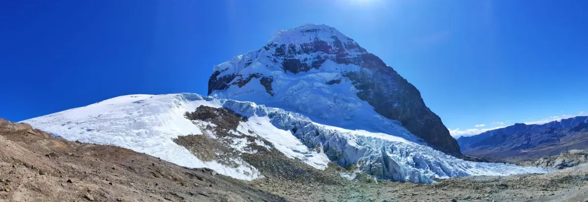 Panorama of a glacier under a clear sky