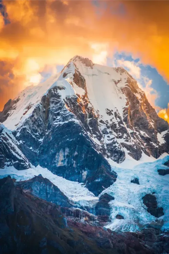 A snow peak glowing orange at sunset